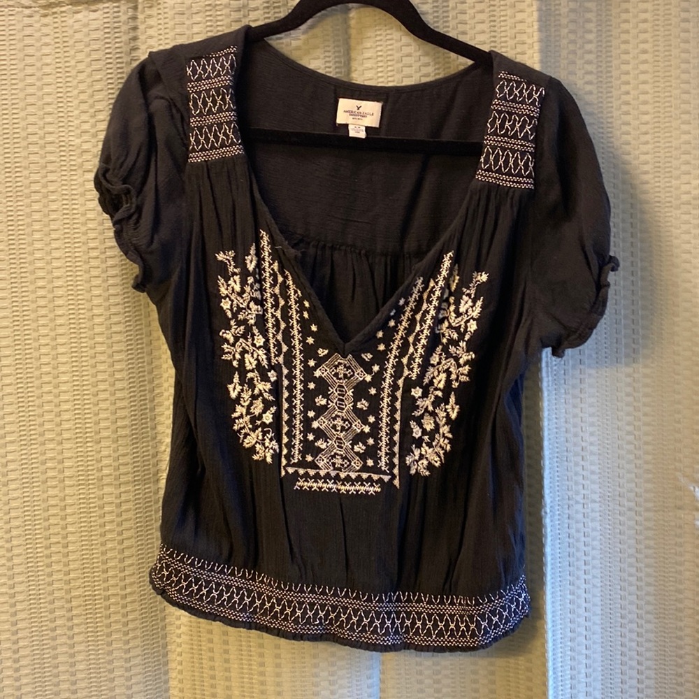 American eagle black top with white embroidered accent size small